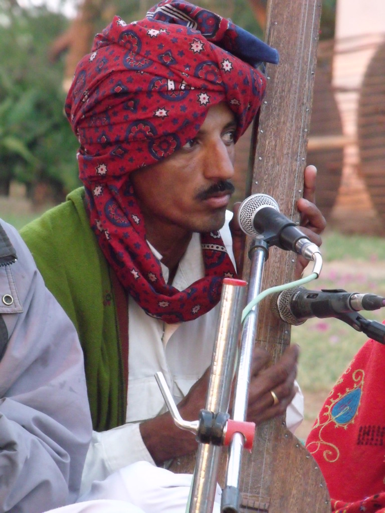 Musician wearing a chemical dyed ajrakh turban in Bhuj, 2011. Photograph: Ruth Clifford