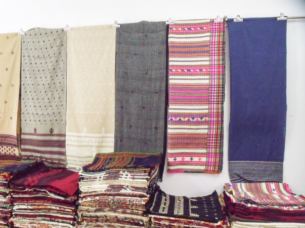 Traditional and contemporary shawls displayed in Shamji's shop