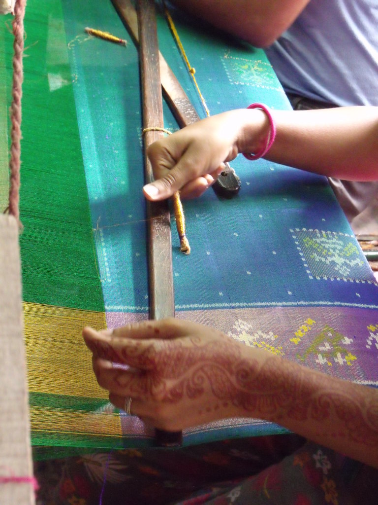 Single ikat weaving adding the imitation zari supplementary pattern