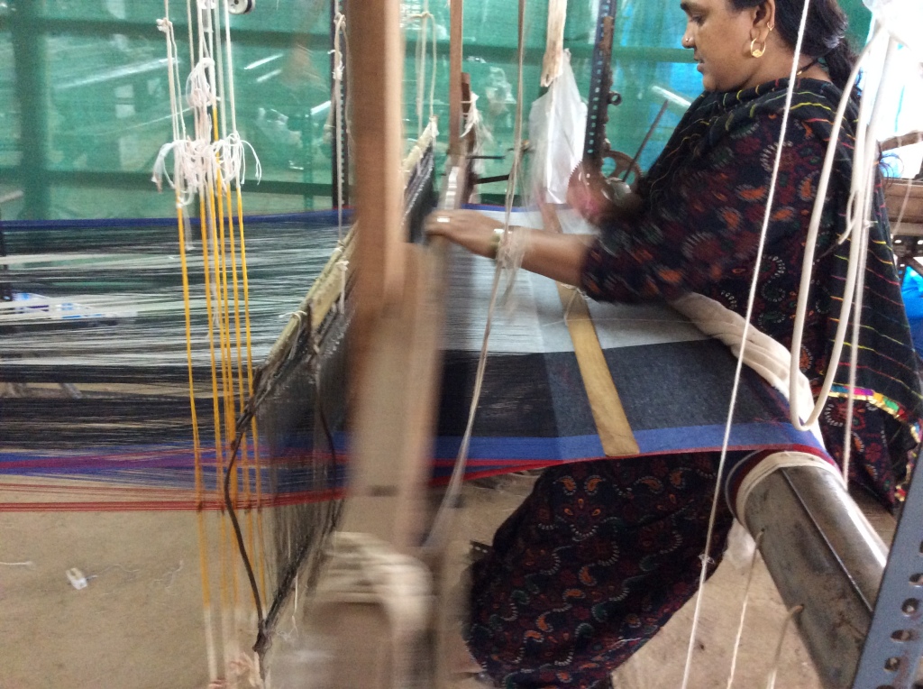 A weaver weaving khadi for the Gudi Mudi project at Women Weave
