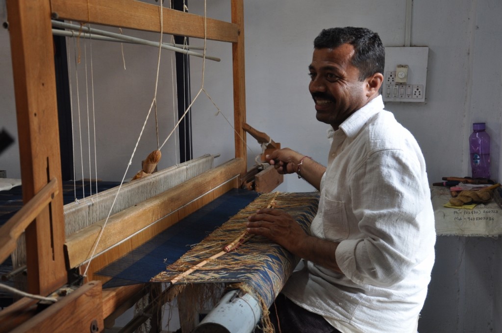 Shami weaving a heavily patterned piece