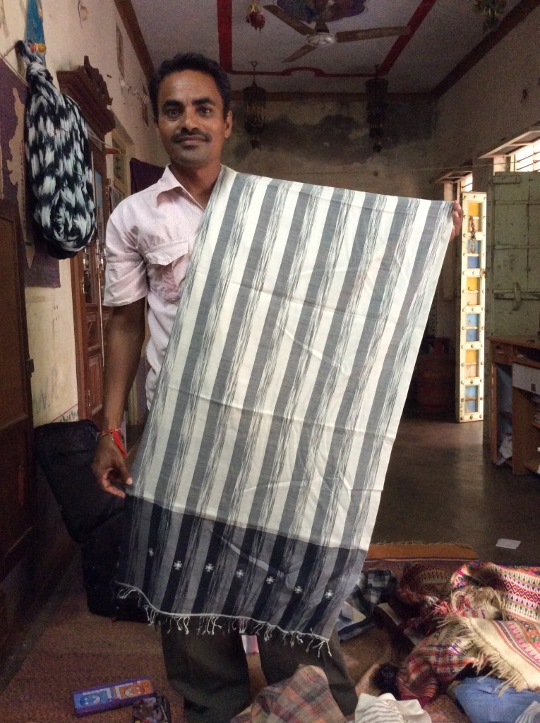 Ramji modelling one of his ikat woven scarves.