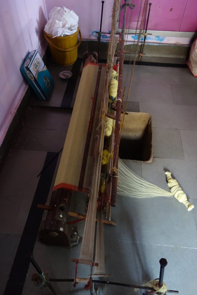 The simple hand-throw shuttle pit loom