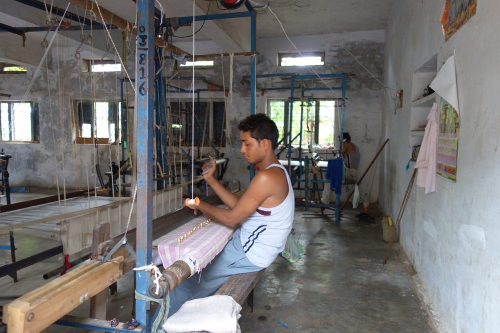 A weaver in the government weaving centre